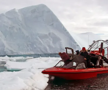 Airboat near ice with passengers